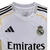 Camisa Real de Madrid I 25/26 - Torcedor Adidas Masculina - Branca com detalhes em cinza e amarelo - Paixão Esportes