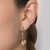 527356 - Brinco Rommanel folheado a ouro palito curvado com esfera - Luxury Joias