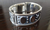 Pulsera Gruesa De Plata Adornada Con Casquillas Y Calados