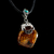 Image of Dije De Ambar Montado En Plata Adornado Con Turquesa Natural
