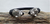Image of Brazalete De Piel Tejida Color Negro Con Serpientes De Plata