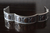 Pulsera Gruesa De Plata Adornada Con Casquillas Y Calados on internet