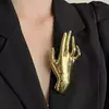 Broche mão