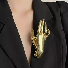 Broche mão