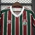 camisa-fluminense-i-25-26-torcedor-umbro-feminina-vermelha-e-verde-com-detalhes-em-branco