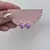 Brinco Cravejado Rosa e Lilas na internet