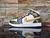 Nike Air Jordan 1 Mid Patent en Negro, Blanco y Dorado - comprar en línea