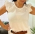 Remera con detalles de broderie en internet
