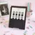 Imagen de Cuaderno A5 Rayado Anillado + Stickers + plancha Qr. Diseño NEGRO
