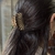 Broche Ostra Dorado - comprar online