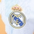 Camisa Real de Madrid Pré-jogo 25/26 - Torcedor Adidas Masculina - Branca com detalhes em laranja e preto e azul - loja online