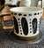 TAZA CON BORDE DORADO "LUNARES Y RAYAS"