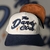 Gorra bordada The Dandy Club