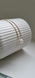 Colar Perola Transpassada I Banhado a Ouro 18K - comprar online