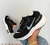 Imagem do nike zoomX preto com branco