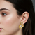 Aretes Flores Doradas Brillantes. en internet