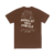 Camiseta marrom com a frase "JESUS MORREU POR MIM, AGORA EU VIVO POR ELE" em destaque na parte de trás.