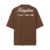 Camiseta oversized marrom com a palavra "KINGDOM" em destaque na parte de trás, com detalhes escrito “PORQUE TEU É O REINO, O PODER E A GLÓRIA PARA SEMPRE, AMÉM”