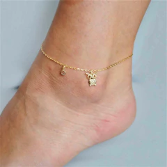 TORNOZELEIRA COM CORUJA E PONTO DE LUZ FOLHEADO A OURO - comprar online