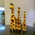 Trio de Girafas em Madeira na internet