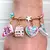 CHARM MOCHILA DOURADA - loja online