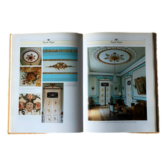 Livro aberto com imagens de pinturas decorativas e sala nobre de fazenda histórica brasileira do período imperial.