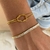Pulseira nó dourada infinito