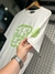 Camiseta Louis Vuitton com Grafismo 1854 branca com verde na internet