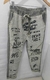 Pantalón gamuzado verde oliva con detalles en negro en internet