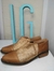 Botas marrones con dorado en internet