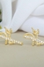 Brinco Fé com Zircônias Banhado em Ouro 18k na internet