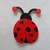 Patch bordado termocolante em formato de joaninha vermelha com bolinhas preta,  ideal para customizar roupas, bolsas e acessórios com um toque divertido e colorido.