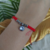Pulsera hilo rojo con dije en internet