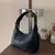 Bolsa Baguette Shine na internet