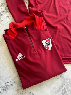 BUZO MEDIO CIERRE BORDO RIVER en internet