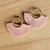 Brinco meia lua, na cor rosa baby, com metais banhados à ouro - comprar online