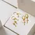 Cartela Trio Argola Pingente Cruz e Bolinha - comprar online
