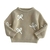 Sweater beige con moños - comprar online