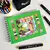 KIT LIVRO DE COLORIR CAPA DURA VERDE + 24 CANETINHA PERMANENTE na internet