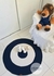 Tapete Infantil redondo , nas cores azul marinho e off white, com 80 cm de diâmetro. na internet