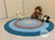 Tapete de Crochê Redondo 1m – Tons de Azul e Cinza | Feito à Mão para Quarto de Bebê - Ateliê Vera Peixoto - tapetes de crochê para decoração quarto de bebê e infantil