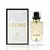 Perfume feminino árabe Léonie Maison Alhambra com frasco transparente e tampa preta, ao lado da embalagem branca com detalhes dourados