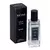 Perfume masculino Brand Collection Dream No. 100 Savage em frasco de vidro transparente com tampa preta ao lado da embalagem preta