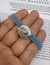 pulseira elastica azul leitosa