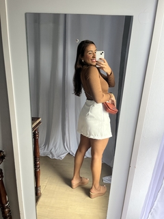 Short Saia Manu na internet