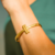 Pulseira T Ouro - comprar online