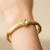 Pulseira Glam Ouro com Pedra Rivoli - Pandoá Acessórios