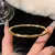 Imagem do Pulseira de Aço Inoxidável com Titânio Incrustado e Zircão Banhado a Ouro – Clássica, Minimalista e Perfeita para o Uso Diário