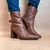 Bota salto alto e bico fino com fivela - comprar online