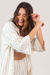 camisa oversized com botão listrada